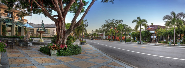Sunrise over the Third Street shopping district in Old Naples, Florida.