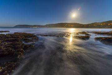 Fototapeta premium A full moon illuminated landscape at Puertecillo Beach close to Santiago de Chile an amazing place for surf and enjoy at the beach, Chile