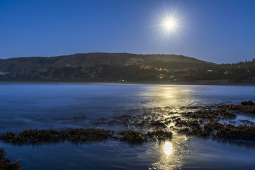 A full moon illuminated landscape at Puertecillo Beach close to Santiago de Chile an amazing place for surf and enjoy at the beach, Chile