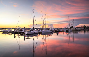 Sunrise over a quiet harbor in old Naples, Florida