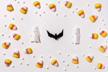 Halloween theme with paper craft decorations on a white background