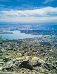 An aerial view over el Yelmo summit and Santillana dam lake at 