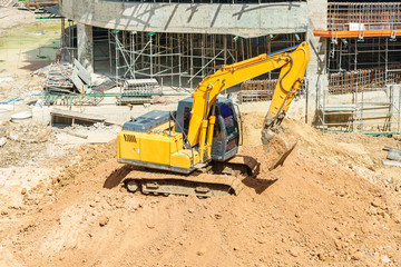 Close up details of industrial excavator working on construction site