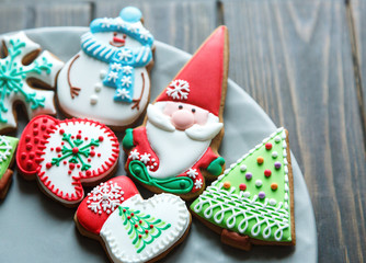 christmas homemade gingerbread cookies, spices and cutting board on dark  background, top view. holiday, celebration and cooking concept. new year and christmas postcard