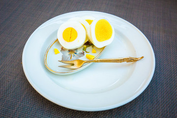 Healthy breakfast with sliced eggs on a plate