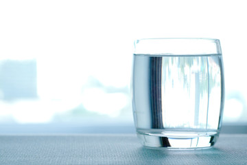 Clean drinking water in clear glass. Put on the table in the reception room Health care concept