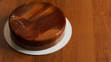 Chocolate mousse cake. The glaze freezes on the biscuits. Very tasty cake close-up.