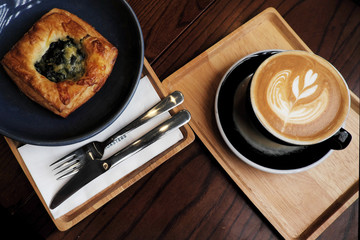 Spinach pie with hot coffee