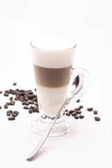 Hot Cappuccino  coffee  in clear glass on a white background in the studio.	