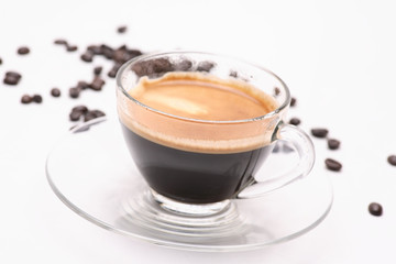 hot coffee  in clear glass on a white background in the studio.	