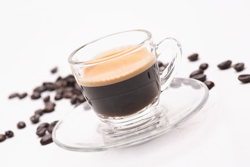 hot coffee  in clear glass on a white background in the studio.	