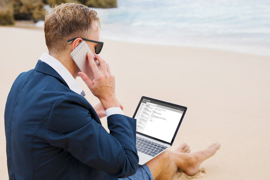 Businessman Working On Beach