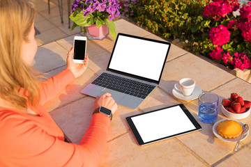 Woman using different tech devices
