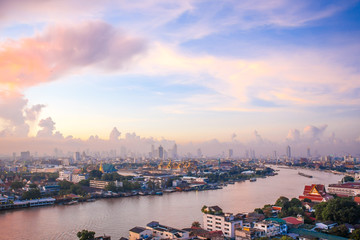 Sun rise The Chao Phraya River Behind the view of the royal palace in the corner.