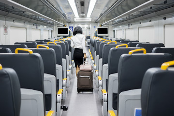 Young businesswoman walking in Airport Train