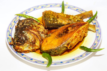 Deep fried Hilsa fish food with tasty fish oil used as a side dish with rice meal. A traditional Bengali Indian non vegetarian cuisine.