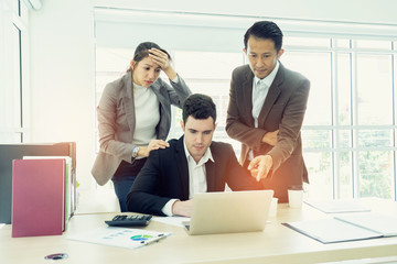 business, teamwork, people and crisis concept. business team sitting  solving problem in office....