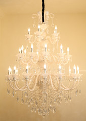 Large chandeliers hung on the ceiling in the hall.