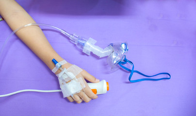 Hand children patient saline intravenous in the hospital .Focus at hand