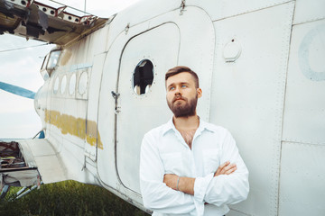 a man on the background of an old plane