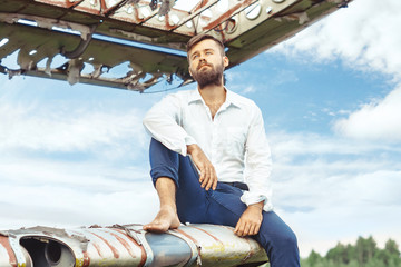 a man on the background of an old plane
