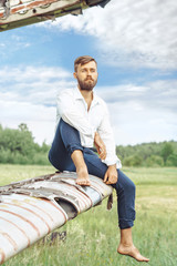 a man on the background of an old plane