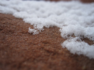 Snow on the red rock in the desert