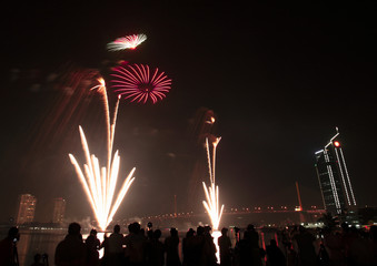 Beautiful fireworks on the banks of the Chao Phraya River at night in Bangkok, Thailand.