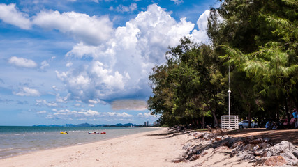 Beautiful Cha-am beach with blue sky and pine trees.