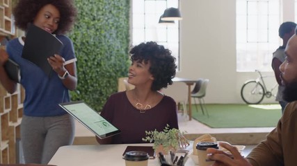 african american business people meeting brainstorming team leader woman presenting finance data using tablet technology sharing project strategy colleagues working together in office boardroom