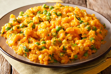 African cuisine - Irio puree of sweet potato with green peas and corn close-up on a plate. horizontal