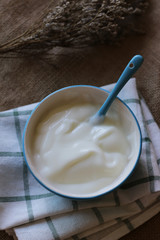 The yogurt is in the cup as high angle shots.