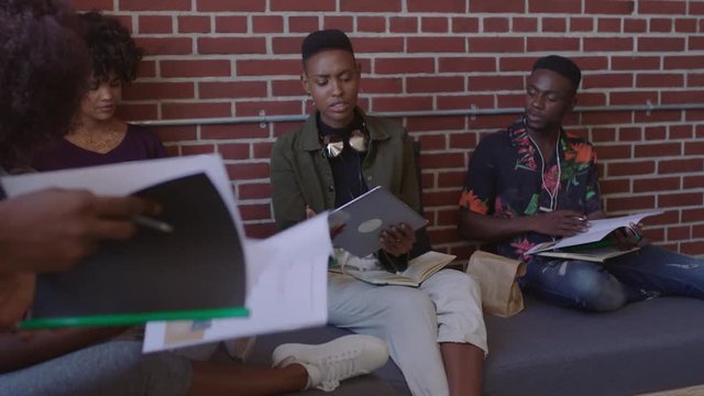 african american business people meeting brainstorming working together on corporate project sharing ideas using tablet technology in relaxed modern office workplace