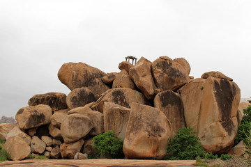 The rocky mountains and hills (and transformers) surrounding temples in Hampi