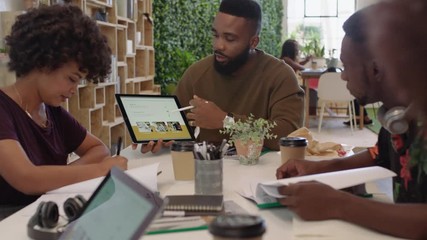 african american business people meeting creative graphic design team brainstorming marketing ideas team leader businessman using tablet computer technology in office boardroom sharing strategy - Powered by Adobe