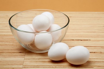 Eggs In Bowl On Wooden Table