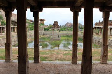 Khrisna Bazaar, pillars, and a pond in Hampi.