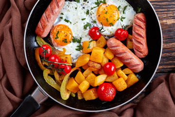 skillet with maple glazed pumpkin, eggs, sausages
