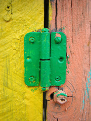 Old hinge on the door close-up