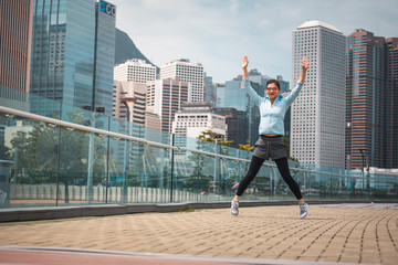Fototapeta na wymiar Urban woman doing workout in the city
