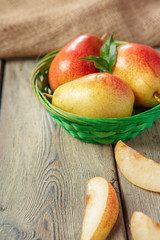 Ripe pears on rustic wooden table