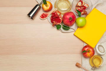 Fototapeta na wymiar Red apple, pomegranate and honey jar for Jewish New Year on wooden board