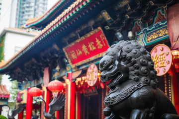 close up Lion Guardian bronze sculpture at the Sik Sik Yuen Wong Tai Sin Temple in Kowloon, Hong Kong.