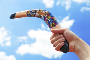 Wooden Boomerang with Blue Sky and Cloud Background - obrazy, fototapety, plakaty
