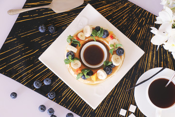Coffee mousse served with fruits and berries