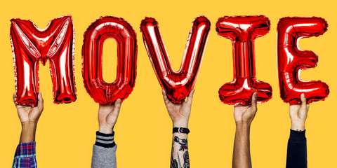 Red alphabet helium balloons forming the text movie