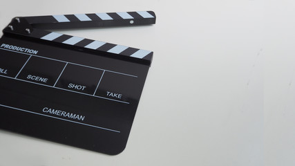 Fototapeta na wymiar Clapper board or movie slate use in video production or movie and cinema industry. It's black color on white background.