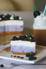 Blueberry souffle mousse cake decorated with fresh berries