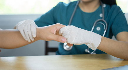 Doctor hand Physicist physical therapy treatment patient in the clinic.Orthopedic medical exam in doctor's hospital office Partnership, traumatology and medical consultation for hand wrist injury - obrazy, fototapety, plakaty