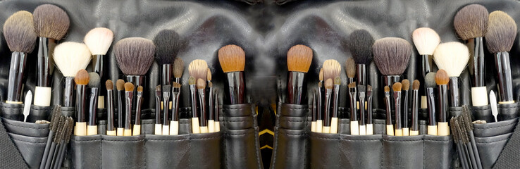 Professional makeup brushes cosmetic in tube, leather bag. close-up brush, makeup tools of ,...